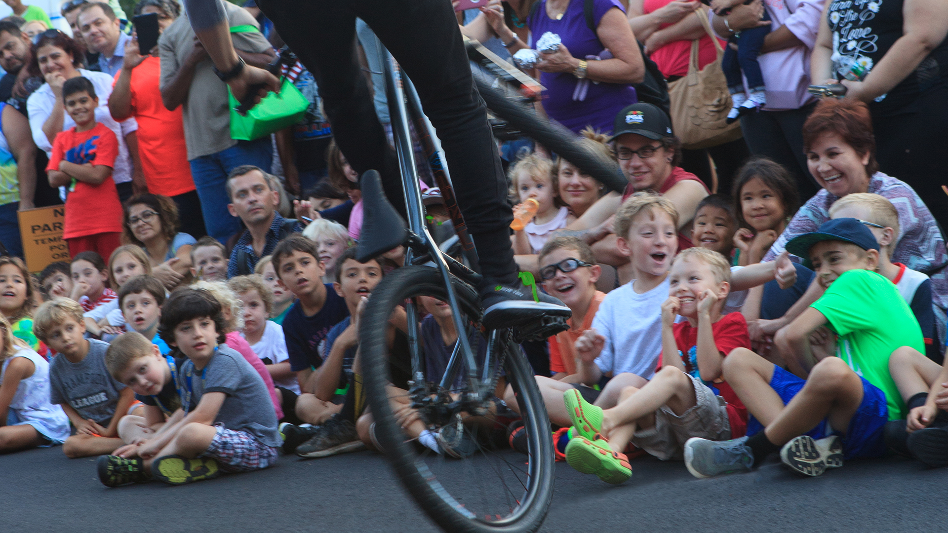 FRONT ROW ACTION! Pro Mountain Bike athlete demonstrates some flat-ground skills at National Night Out in Summit New Jersey