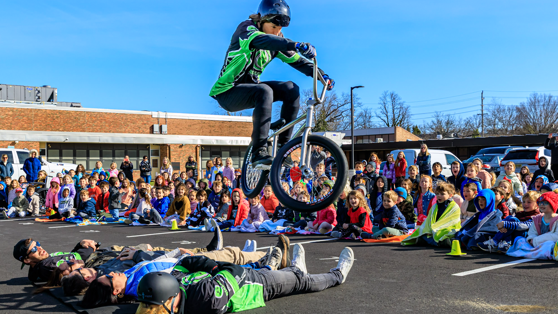 HUGE HOP! BMX pro Ricky Veronick clears 5 brave teachers at a school in Fair Haven New Jersey