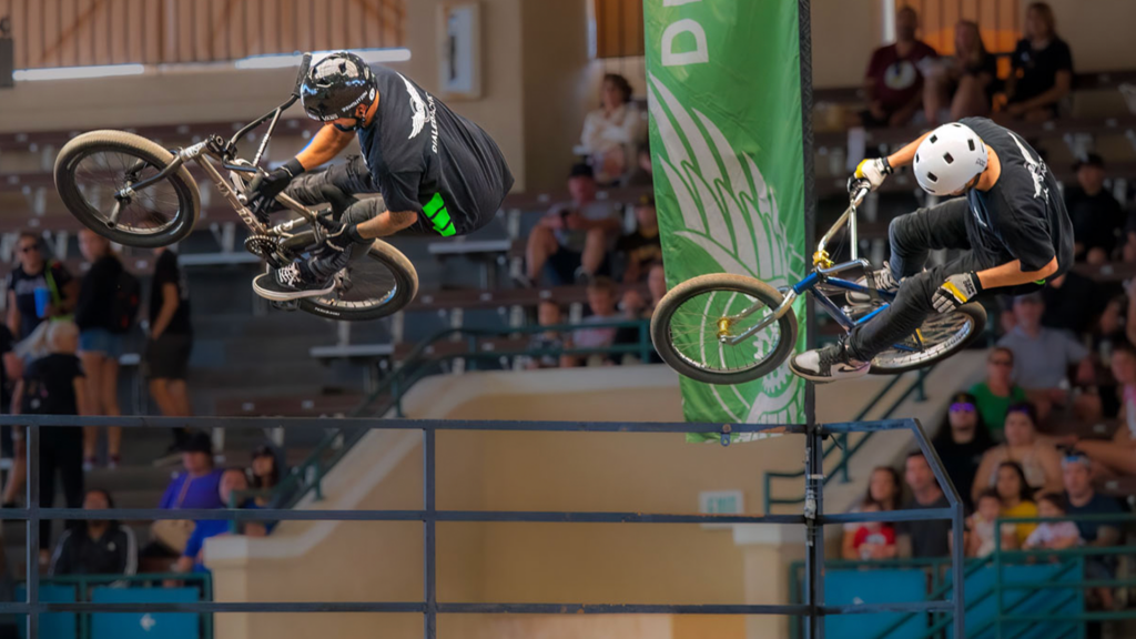 Two BMX athletes airing-out the quarter pipe at the San Diego Fair in Southern California