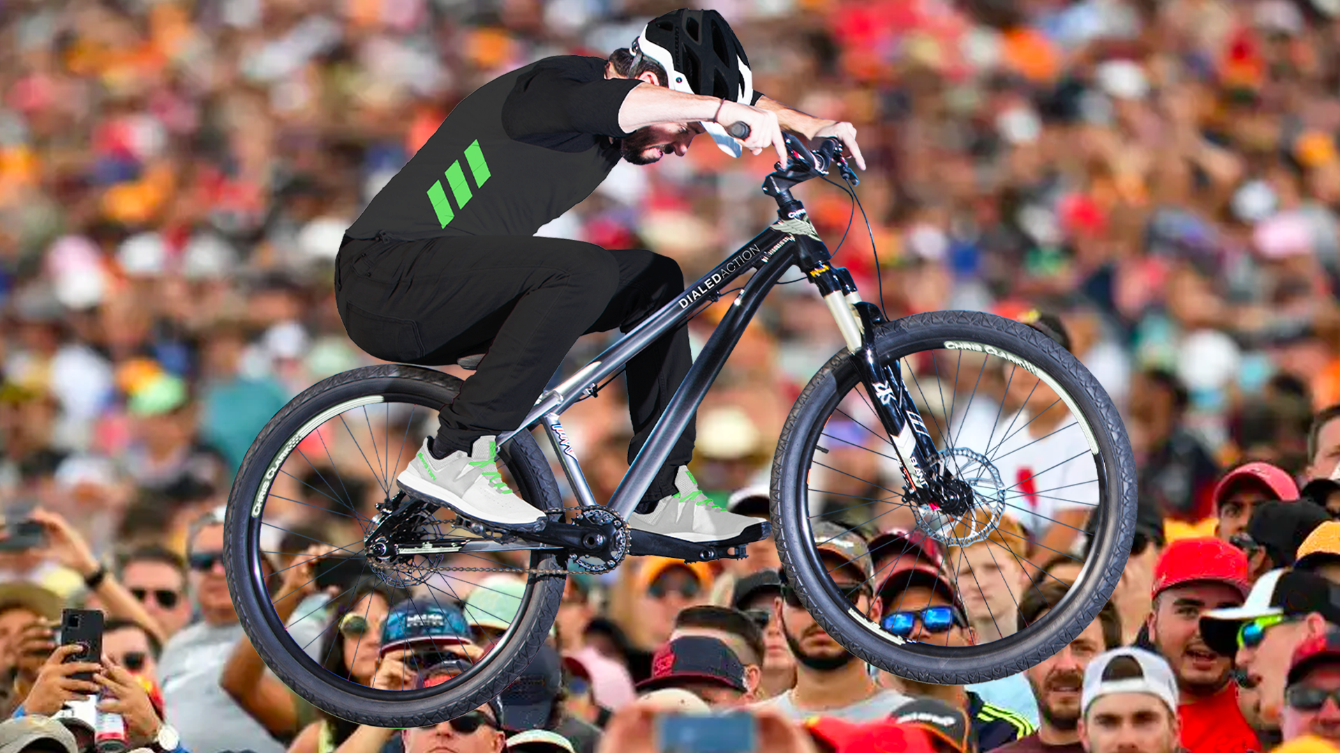 Mountain Bike athlete pauses mid-air during a grandstand performance program