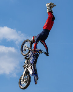 Dialed Action FMX athlete flies over Monster Trucks